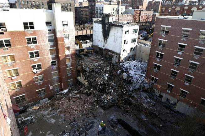 Rubble is seen Friday, March 14, 2014, two days after a natural gas explosion leveled two apartment buildings in New York. Using sound devices to probe for voices and telescopic cameras to peer into small spaces, workers searching a pile of rubble from a gas explosion in the East Harlem section of Manhattan continued to treat it as a rescue operation, holding onto the possibility of finding survivors from a blast that brought down two apartment buildings and killed at least eight people.