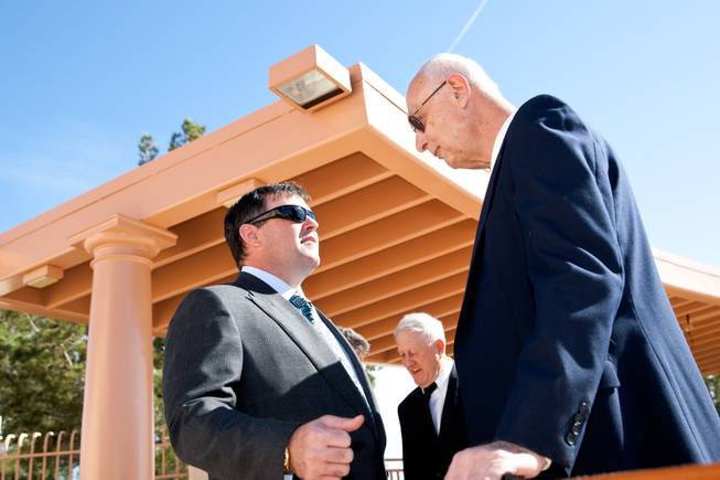 Thirty-year friend Tony Hegler, right, visits with Brendan Gaughan, a grandson of Jackie Gaughan, while attending the memorial mass for John Davis "Jackie" Gaughan held at St. Viator Catholic Church in Las Vegas on St. Patrick's Day, March 17, 2014.