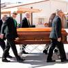 Pallbearers carry the casket of John Davis "Jackie" Gaughan into St. Viator Catholic Church for a memorial mass in Las Vegas on St. Patrick's Day, March 17, 2014.