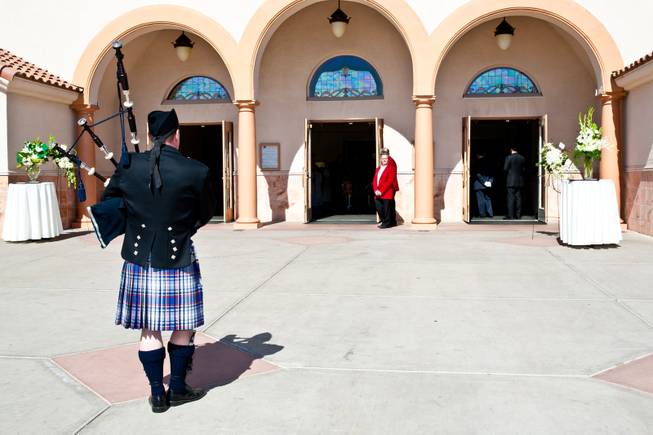 Bag pipes continue to be played as the casket of John Davis "Jackie" Gaughan disappears into the sanctuary for the memorial mass held at St. Viator Catholic Church in Las Vegas on St. Patrick's Day, March 17, 2014.  Jackie Gaughan, 93, passed away March 12, 2014.