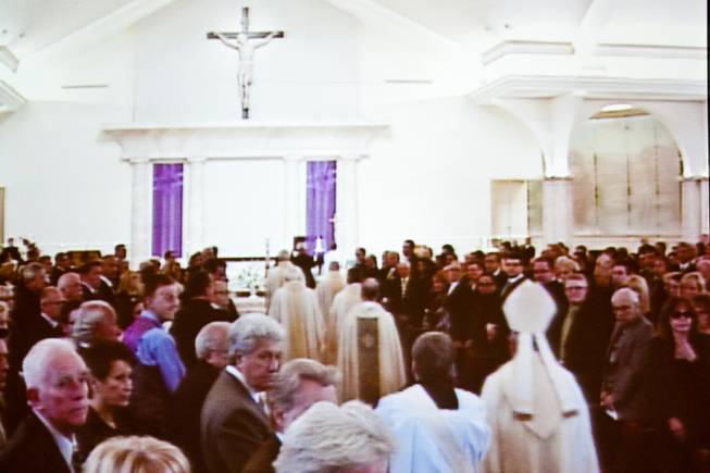 As seen on an overflow video monitor, the memorial mass begins for John Davis "Jackie" Gaughanat St. Viator Catholic Church in Las Vegas on St. Patrick's Day, March 17, 2014.  Jackie Gaughan, 93, passed away March 12, 2014.