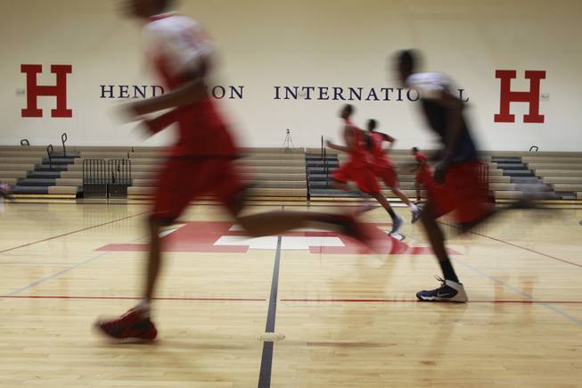 Findlay Prep basketball players run during practice Tuesday, March 18, 2014.