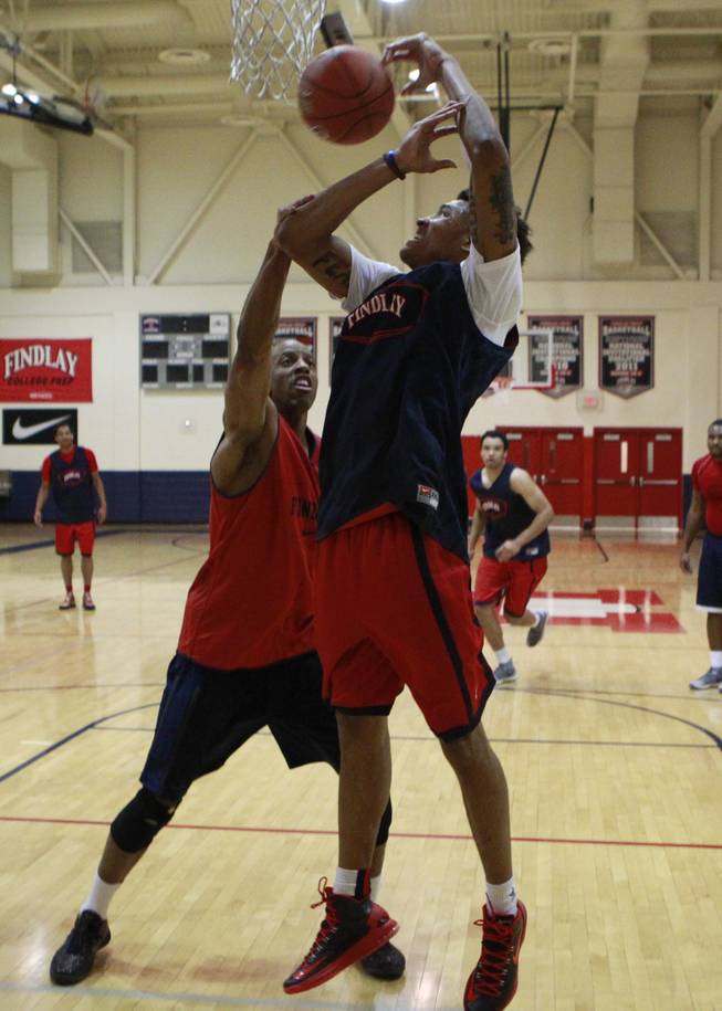 Findlay Prep guard Kelly Oubre is fouled by head coach Jerome Williams during practice Tuesday, March 18, 2014.