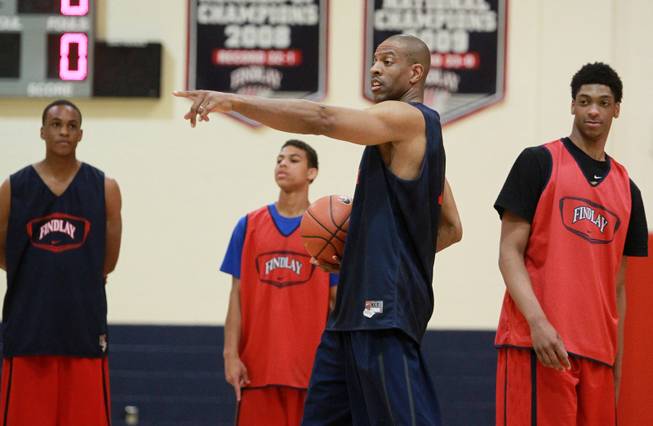 Findlay Prep head coach Jerome Williams directs his players during practice Tuesday, March 18, 2014.