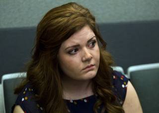 Former Foothill High School teacher Amanda Brennan, who pleaded guilty to romancing a teenager, listens to District Court Judge James A. Brennan during her sentencing hearing Tuesday, March 18, 2014.