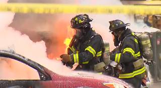 In this image made from video provided by KOMO-TV, emergency crews respond to the scene of a news helicopter crash outside the KOMO-TV studios near the space needle in Seattle, Tuesday, March 18, 2014, in Seattle.