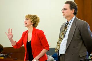 Lisa Zastrow, attorney for the Animal Foundation, and Deputy Dist. Attorney Steven Sweikart address the court during a civil hearing between Donald Thompson, co-owner of Prince and Princess Pet Shop LLC, and the Animal Foundation at the Regional Justice Center, Wednesday, March 19, 2014.