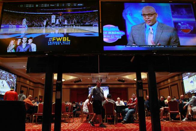 Multiple video monitors are set up at the South Point during the second round of the NCAA basketball tournament Thursday, March 20, 2014.