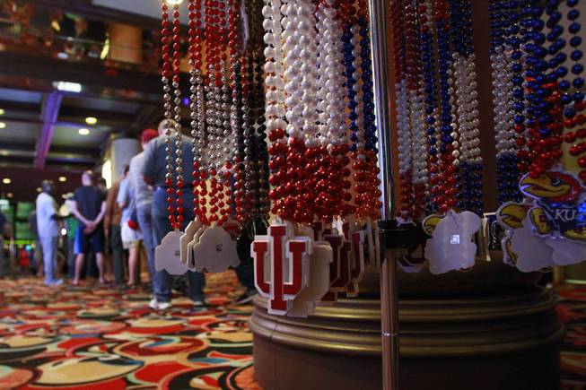 University themed necklaces for sale are positioned outside the LVH sports book during the second round of the NCAA basketball tournament Thursday, March 20, 2014.