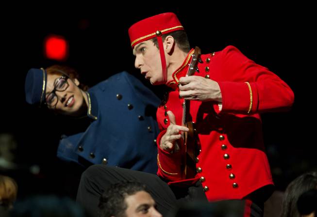 Bellhops entertain the crowd before the start of the One Night for ONE DROP dress rehearsal from the Michael Jackson ONE Theatre at Mandalay Bay on Thursday, March 20, 2014.