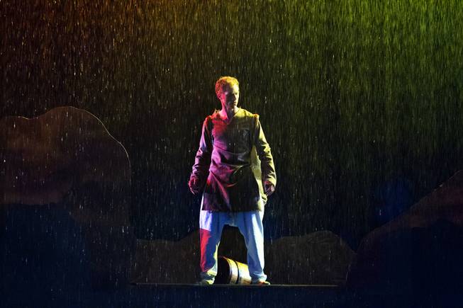 The Seeker looks down while in the rain during the One Night for ONE DROP dress rehearsal from the Michael Jackson ONE Theatre at Mandalay Bay on Thursday, March 20, 2014.