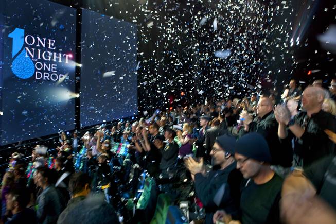 Confetti drops from the rafters over the crowd following the  One Night for ONE DROP dress rehearsal from within the Michael Jackson ONE Theatre on Thursday, March 20, 2014.