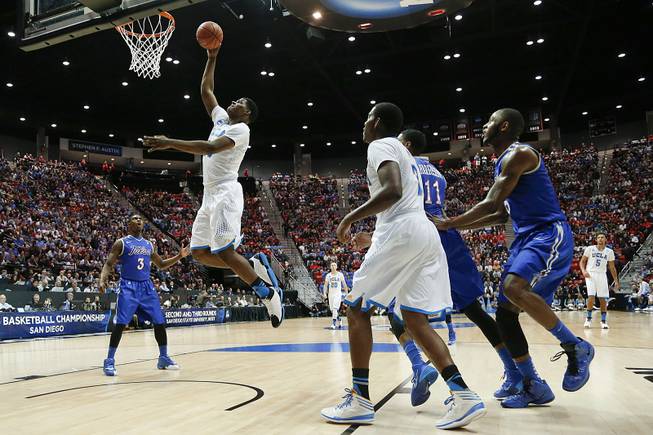 UCLA forward Tony Parker, second from left, shoots against Tulsa during the first half of a second-round game in the NCAA men's college basketball tournament Friday, March 21, 2014, in San Diego. 