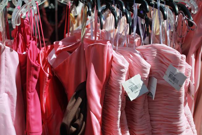 A rack of pink dresses is seen during Las Vegas Prom Closet's "Operation Glass Slipper" Saturday, March 22, 2014.