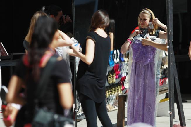 Young women look for accessories during Las Vegas Prom Closet's "Operation Glass Slipper" Saturday, March 22, 2014.