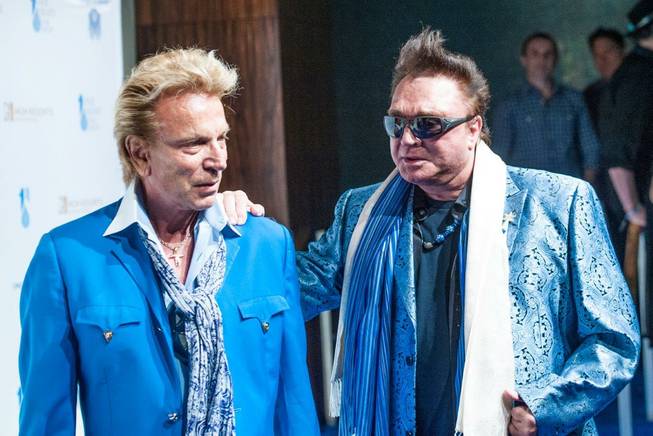 Siegfried & Roy walk the blue arrivals carpet for Cirque du Soleil's "One Night for One Drop" in front of Aureole on Friday, March 21, 2014, at Mandalay Bay.