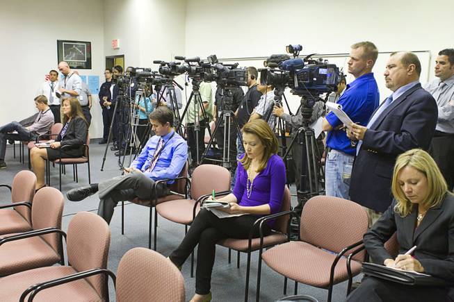 Reporters and photographers cover a news conference at Clark County School District Police Headquarters in Henderson Monday, March 24, 2014. Officials addressed questions about an investigation into the possible misuse of funds by employees in the Adult English Language Acquisition Services (AELAS) department.