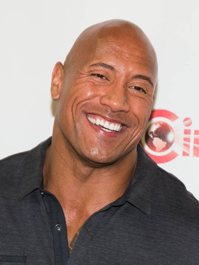 Dwayne Johnson arrives at the opening night presentation and party hosted by Paramount Pictures for 2014 CinemaCon at the Colosseum on Monday, March 24, 2014, in Caesars Palace.