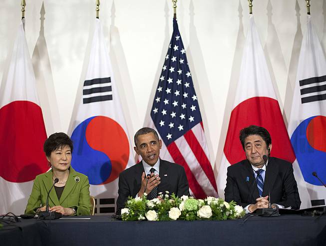 President Barack Obama meets with Japanese Prime Minister Shinzo Abe, right, and South Korean President Park Geun-hye at the U.S. Ambassador's Residence in the Hague, Netherlands, March 25, 2014.