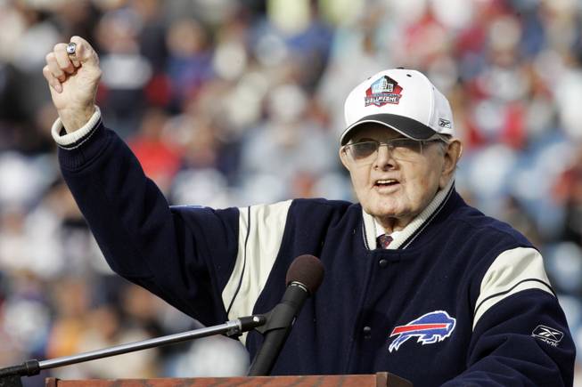 In this Nov. 1, 2009, file photo, Buffalo Bills' owner Ralph Wilson Jr. holds up his Hall of Fame ring during a halftime NFL football ceremony against the Houston Texans in Orchard Park, N.Y.
