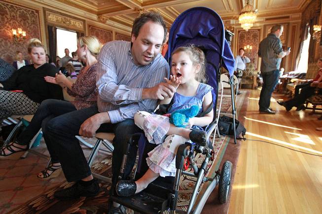 Clinton Atwater plays with his daughter Asia Skye Atwater, 7, before the HB 105 bill signing ceremony at the Utah State Capitol, Tuesday, March 25, 2014, in Salt Lake City. 