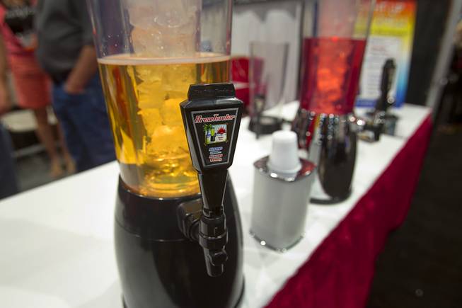 BrewTender beverage dispensers are displayed during the Nightclub & Bar Convention and Trade Show at the Las Vegas Convention Center Wednesday March 26, 2014.  The dispenser comes with an ice chamber to keep the beverage cool.