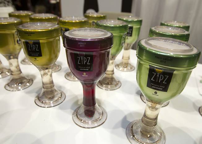 Zipz single-serve wine is displayed during the Nightclub & Bar Convention and Trade Show at the Las Vegas Convention Center Wednesday March 26, 2014. The wine, in a high-quality plastic glass, is a solution for serving in places where real glass is not allowed.