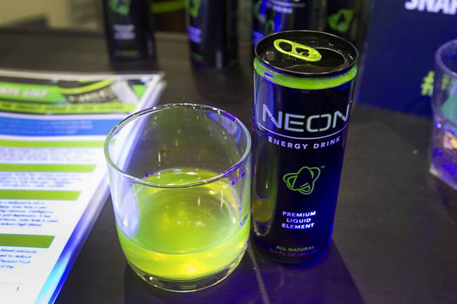 A Neon energy drink glows  under a blacklight during the Nightclub & Bar Convention and Trade Show at the Las Vegas Convention Center Wednesday March 26, 2014.