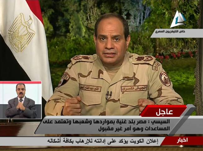 In this image made from video broadcast on Egypt's State Television, Egypt's military chief Abdel-Fattah el-Sissi speaks in a nationally televised speech, announcing that he will run for president, in Cairo, Egypt, Wednesday, March 26, 2014.