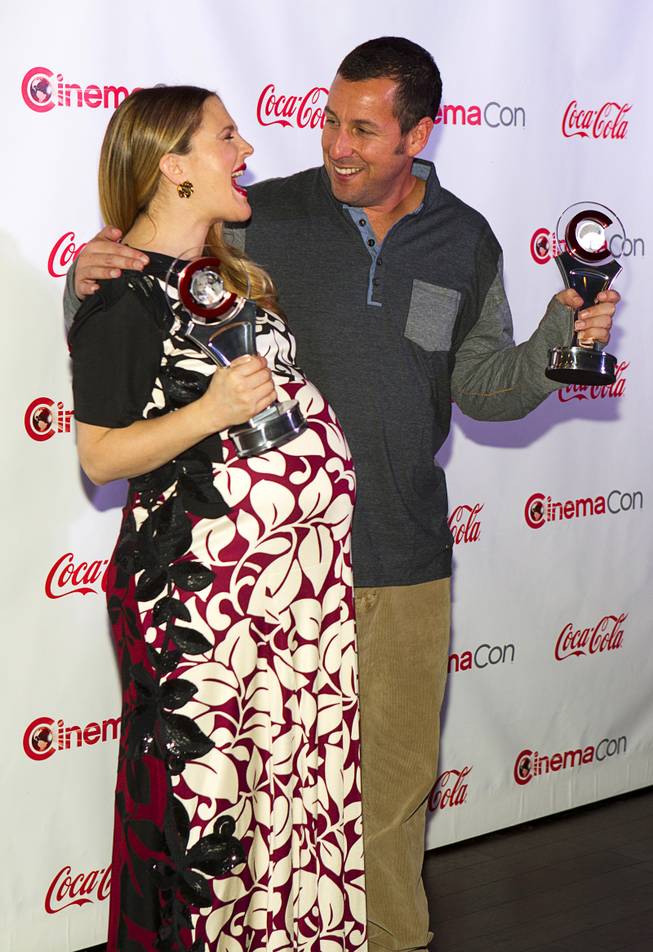 Drew Barrymore and Adam Sandler arrive for the Big Screen Achievement Awards during CinemaCon, the official convention of the National Association of Theatre Owners, at Caesars Palace Thursday, March 27, 2014. Barrymore was the recipient of the Female Star of the Year award. Sandler received the Male Star of the Year award.