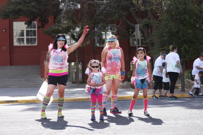 A group of participants pose for the camera during the 5k Bubble Run in downtown Las Vegas Saturday, March 29, 2014.
