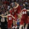 Wisconsin players react as time runs out in overtime in a regional final NCAA college basketball tournament game, Saturday, March 29, 2014, in Anaheim, Calif. Wisconsin won 64-63 in overtime.