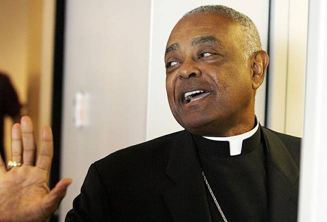 In this Aug. 26, 2008, file photo, Archbishop Wilton Gregory of Atlanta exits the St. Clair County Courthouse in Belleville, Ill. Gregory apologized Monday, March 31, 2014, for building a $2.2 million mansion for himself, a decision criticized by local Catholics who cited the example of austerity set by the new pope. 