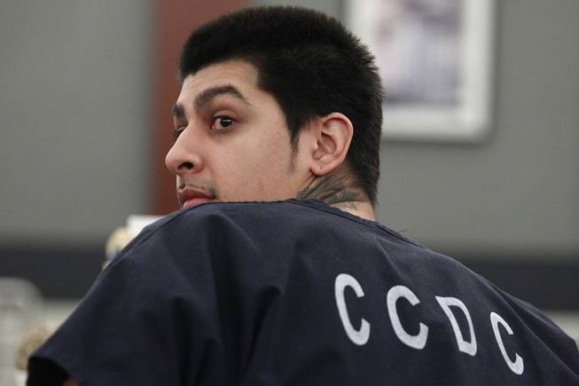 Peter Andrade Jr. looks behind himself during his preliminary hearing on attempted murder and other charges Tuesday, April 1, 2014.