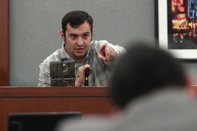 Shooting victim Cesar Flores points out Peter Andrade Jr. during Andrade's preliminary hearing on attempted murder and other charges Tuesday, April 1, 2014.