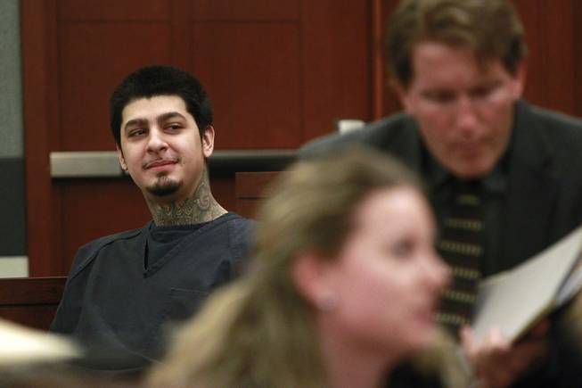 Peter Andrade Jr. smiles in the direction of his girlfriend who is sitting in the gallery before his preliminary hearing on attempted murder and other charges Tuesday, April 1, 2014.