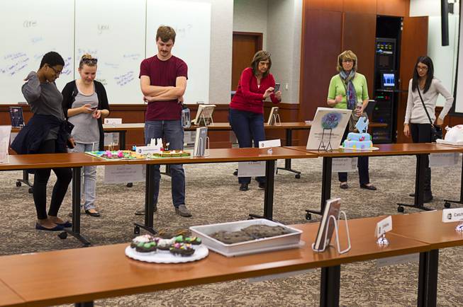 Students look over entries during the 2014 Edible Book Festival at the UNLV Lied Library Tuesday, April 1, 2014. Students were challenged to create edible creations inspired by books.