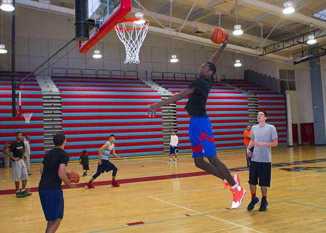 Nate Grimes, a member of the Las Vegas Knicks, attempts a dunk during practice at Western High School Wednesday, April 2, 2014. The club team has gone from starting its program to being nationally ranked in three years. Now they have a sponsorship from Reebok.
