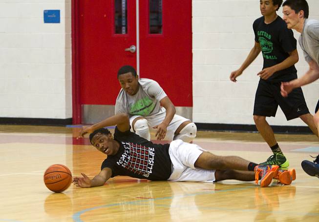 Deon Whiteside, a member of the Las Vegas Knicks, reaches for a loose ball during practice at Western High School Wednesday, April 2, 2014. The club team has gone from starting its program to being nationally ranked in three years. Now they have a sponsorship from Reebok.