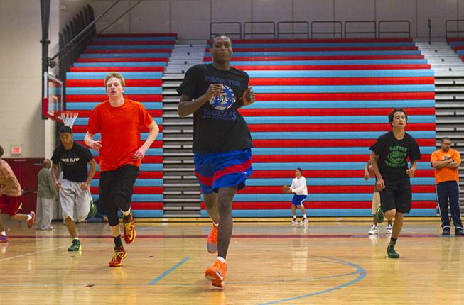 Nate Grimes, center, and other members of the Las Vegas Knicks, runs during practice at Western High School Wednesday, April 2, 2014. The club team has gone from starting its program to being nationally ranked in three years. Now they have a sponsorship from Reebok.