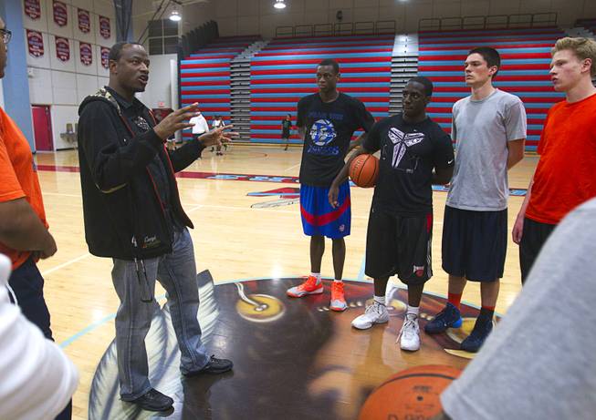 Las Vegas Knicks coach Lamar Bigby talks with players after practice at Western High School Wednesday, April 2, 2014. The club team has gone from starting its program to being nationally ranked in three years. Now they have a sponsorship from Reebok.