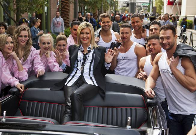 Olivia Newton-John makes her official Las Vegas arrival with a welcome event Wednesday, April 2, 2014, at the Linq. Pictured with Newton-John: “Jubilee” at Bally’s showgirls and Chippendales at the Rio stars Jaymes Vaughan, Ryan Stuart, Matt Marshall, Jon Howes, Nathan Minor and James Davis.