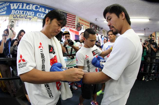 Manny Pacquiao works out during media day at the Wild Card Boxing Club in Hollywood, Calif. Wednesday, April 2, 2014 for his eagerly-anticipated rematch against undefeated WBO World Welterweight  champion Timothy Bradley.