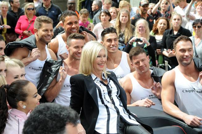 Olivia Newton-John, with Chippendales at the Rio stars Jaymes Vaughan, ...