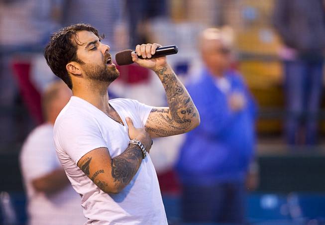 Franky Perez sings the national anthem during the Las Vegas 51s season opener against the Fresno Grizzlies on Thursday, April 3, 2014.