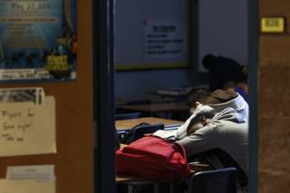 A student rests his head on a desk during first period at Cheyenne High School Thursday, April 3, 2014.