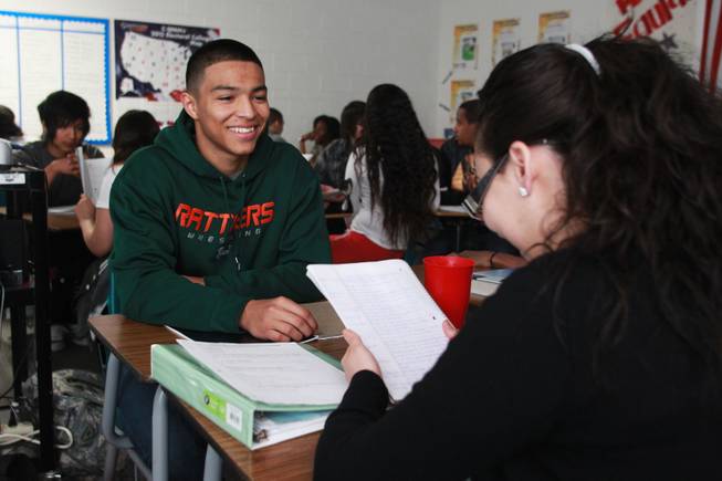 Angel Garcia, left, and Elizabeth Aceves-Arias work on vocabulary words in their AP government class at Mojave High School Thursday, April 3, 2014.