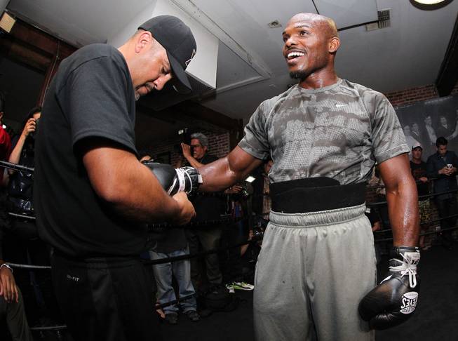 Undefeated WBO World Welterweight champion Timothy Bradley gets his gloves laced by trainer Joel Diaz during media day during media day Thursday, April 3, 2014 at Fortune Gym in Hollywood,Ca. for his eagerly-anticipated rematch against superstar Manny Pacquiao.