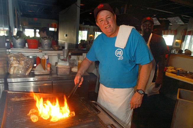 Uncle Bubba’s Oyster House chef and owner Bubba Hiers, who also is Paula Deen’s brother, grills oysters at the Savannah, Ga., restaurant on June 23, 2006.