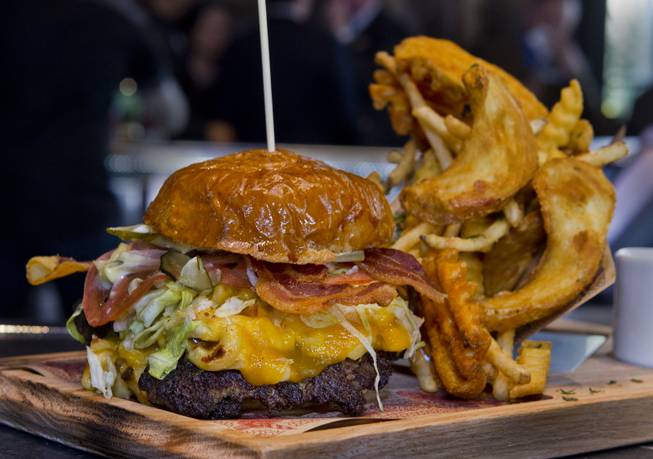 The Mac & Cheese Bacon Burger on the menu at Guy Fieri's Vegas Kitchen & Bar set to open later this month on Friday, April 4, 2014.